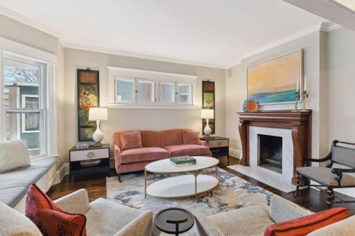Gorgeous hardwood floors throughout, crown moulding, and a beautifully preserved wood mantle with marble surround. Woodburning fireplace.