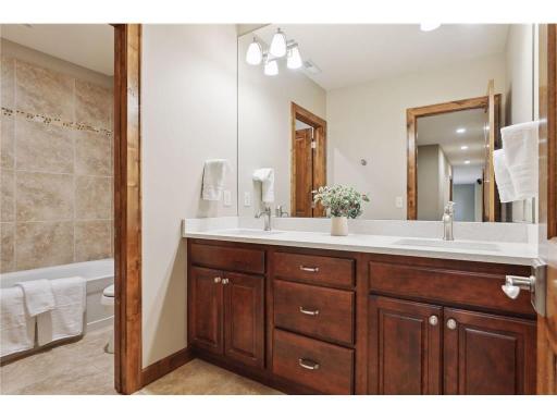 Full Bath on lower level with new quartz countertops & hardware.