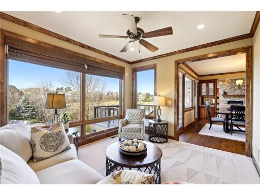 Inviting Sun Room overlooks the stellar backyard pool & pond.