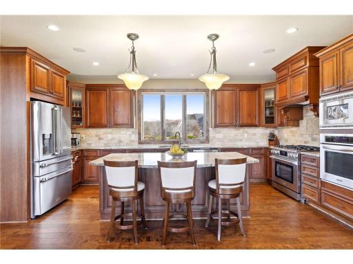 Gourmet Kitchen features center island with breakfast bar & stainless steel appliances (most are new!)