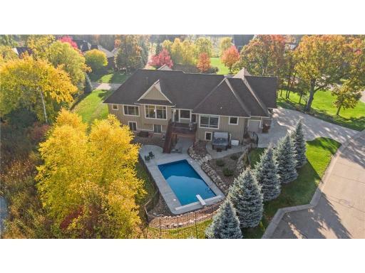 Step into your own private oasis, where nature surrounds this immaculate home - complete with a refreshing pool, soothing hot tub, and convenient main-level living!