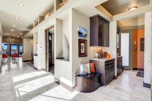 The main level laundry room offers storage cabinetry and is located right off the garage.