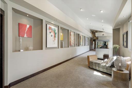 The upper level, oversized hallway offers an additional sitting space and art display area.