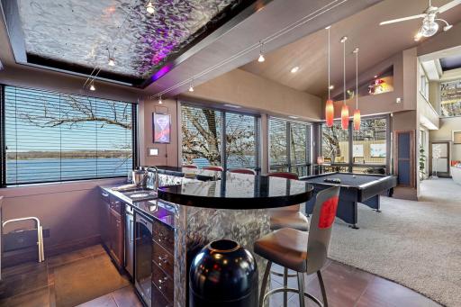 Enjoy the luxurious bar/entertainment area complete with a wine fridge, dishwasher, trash compacter and garbage disposal.