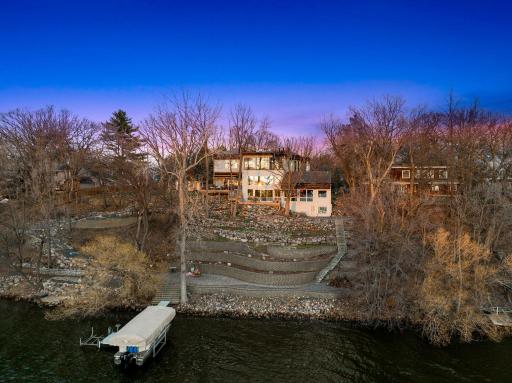 The home was built as close to the bluff as possible, which enabled the size, the tree-house like views, and the massive, flat, front yard space.