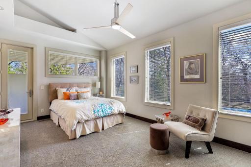 Two of the upper level bedrooms feature vaulted ceilings and walk out to a large porch.
