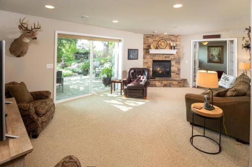 Here is the cozy lower level family room, with gas burning fireplace. Walk out to your perfect patio!