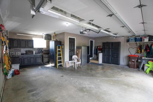 Heated attached garage, with lots of storage cabinets!