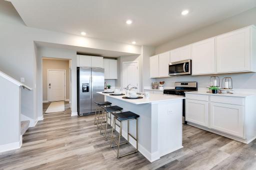 The Hudson's kitchen is elegant and spacious! (Model home, colors will vary)
