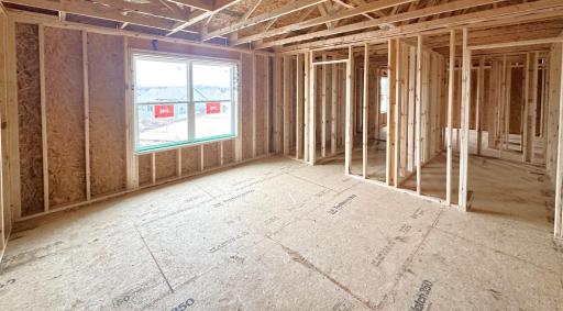 Pardon the mess! Home is currently under construction. Picture is of actual home. Primary bedroom is highlighted by the private, ensuite bathroom and walk-in closet. Not to mention the pond views!