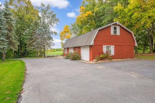Carriage house has two parking stalls and extra storage