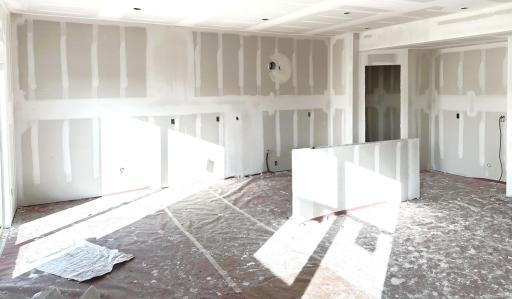 Pardon the mess! Home under construction. Dining on the left with kitchen on the right. *Picture is of actual home.