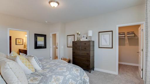 The Clifton floor plan includes TWO walk in closets in the primary bedroom. Great for his and hers or extra home storage. Model photo. Options and colors will vary. See listing agent for home specific selections.