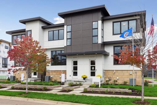 Front view of this 3 unit townhome building. The curb appeal is a standout!