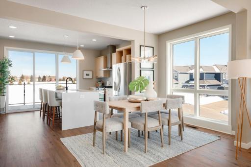 This photo shows the optional "quartz waterfall edge" on the island. It's such a clean and elegant feature that we offer. Photo is of similar floorplan; options and features will vary.