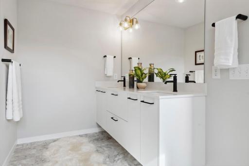 Owner's bath with floating double sink vanity.
