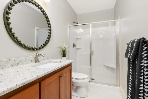 Lower level bathroom with walk in shower.