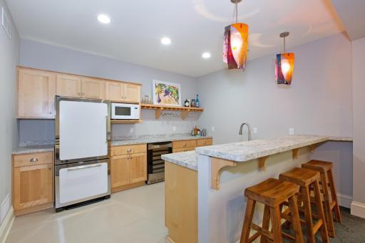 The lower level kitchen is ideal for entertaining and guests.