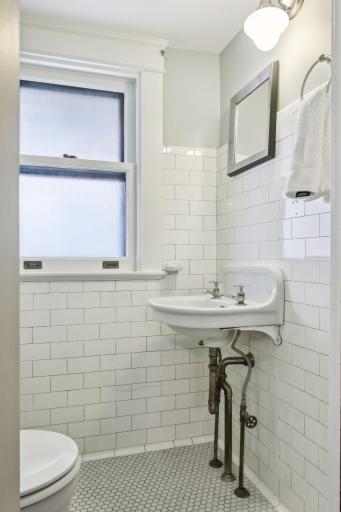 This main level powder room is every bit as darling in person. Perfectly restored and tucked away. You Will love the tile!