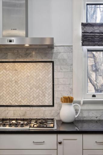 Gorgeous marble tile was selected for the back splash and the cook area is gorgeous.