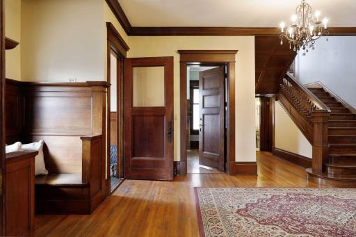 As you walk into the foyer, the high ceilings, natural light and gorgeous chandelier, stunning woodwork and millwork, and stunning ceiling height.