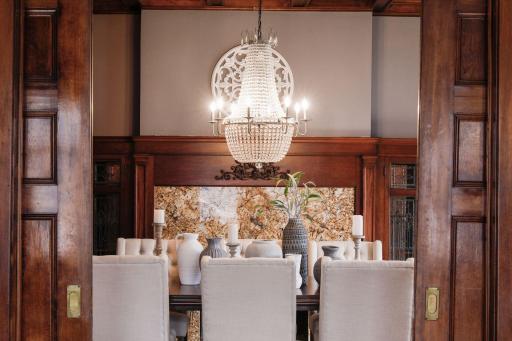 As soon as you step into the dining room, your eyes are immediately drawn to the stunning centerpiece hanging from the ceiling. The chandelier commands attention and becomes the focal point of the room, creating a sense of grandeur and luxury.
