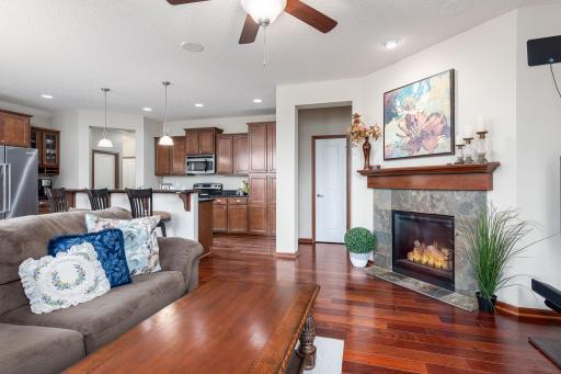 Bright main level living room with a cozy gas fireplace and tons of great natural light