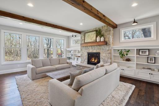 Wood beams, fireplace and lots of windows.