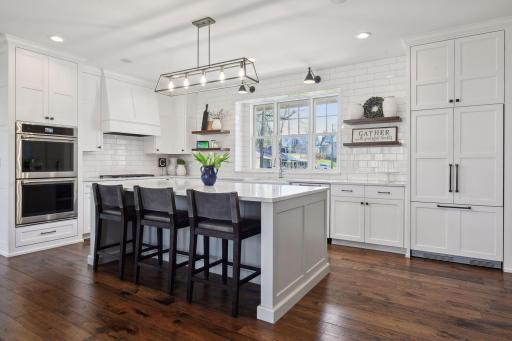 Stunning kitchen with great lighting, double ovens and custom cabinets