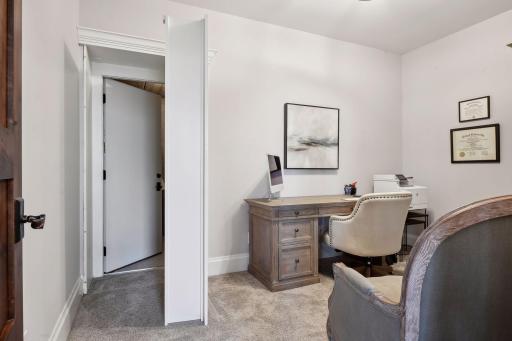 One lower level offices has huge storage area behind book shelf!