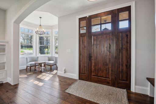 A quaint sitting space just off the foyer, also perfectly suited for a piano.