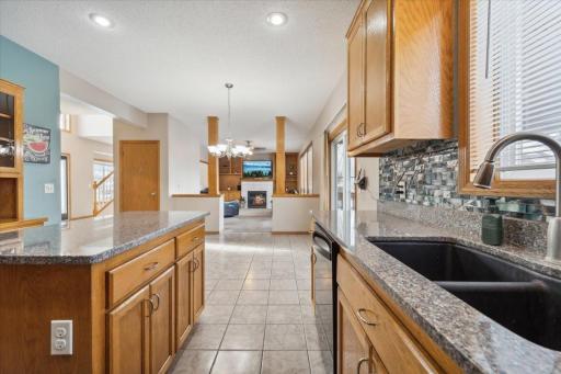 Tiled kitchen floors, tile backsplash & granite counters make your kitchen complete