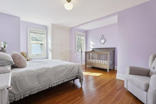Three additional bedrooms, a full bathroom and laundry complete the upper level.