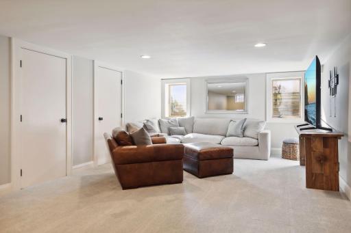 The lower level showcases the family room, three-quarter bathroom, sport court and Finn Sisu sauna.