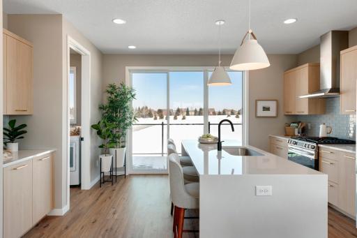 Urban inspired interiors with luxury features. Photo is of similar floorplan; options and features will vary.