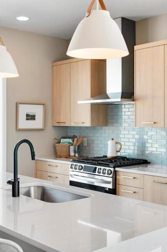 Urban inspired interiors with luxury features. Photo is of similar floorplan; options and features will vary.