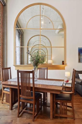 Large Mounted Architectural Mirrors highlight the Dining Area