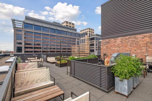 The shared rooftop deck includes a grill area.