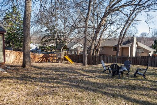fully fenced-in backyard and kids play area