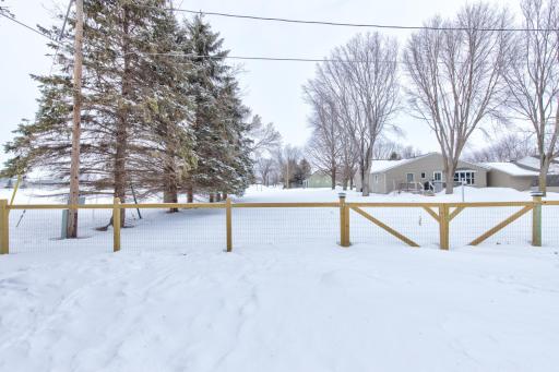 This is a double lot - the land across from this fence is also included with the property
