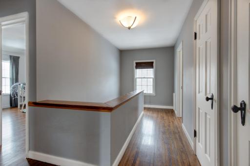 Moving upstairs you are met with original oak wood flooring