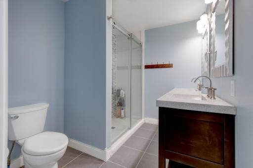 Past the kitchen you will find a beautifully remodeled 3/4 bathroom