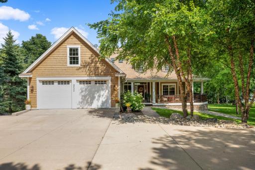 Perched on almost an acre of land with 130 feet of shoreline on Piersons Lake and graced by a variety of trees and perennials, this home and its landscaping create a welcoming appeal.