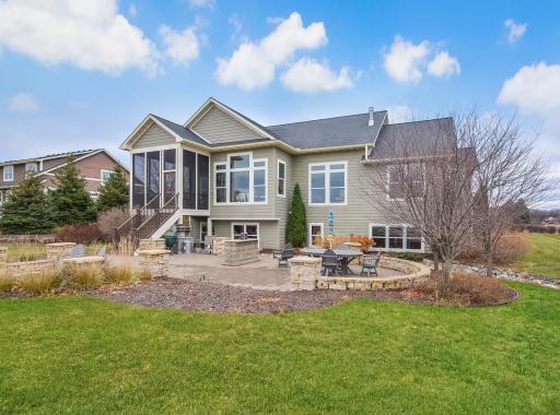Screen porch with staircase to the outdoor area for recreation and entertainment.