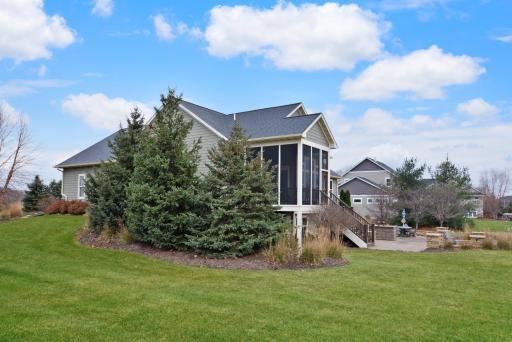 Professionally landscaped for privacy.