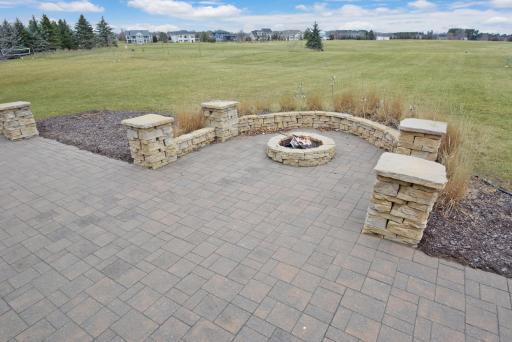 Custom-built fire pit with area for surrounding seating.