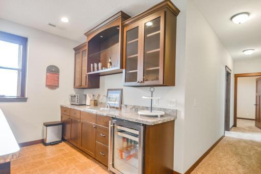 Built-in cabinets, beverage fridge, and sink.