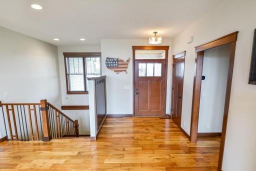 WELCOME! The front door to greet guests and coat closet. Hardwood 3-panel doors throughout the home.