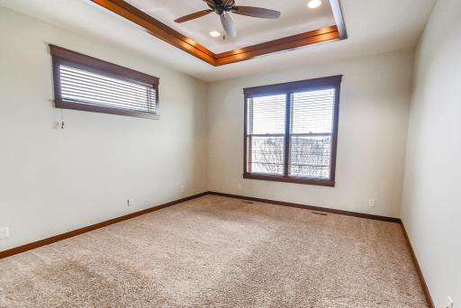 Main floor owner's bedroom 15X13 with lighted tray ceiling and fan.