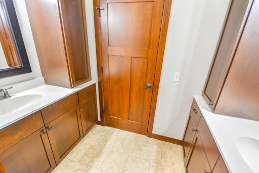 Lower level full bath with dual built-in vanities/sinks.